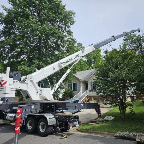 white truck with a crane in action